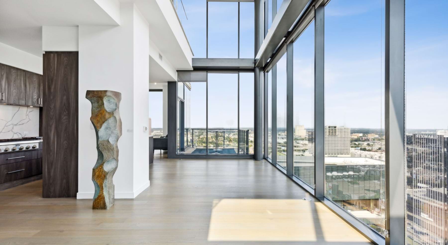 a living room with large windows