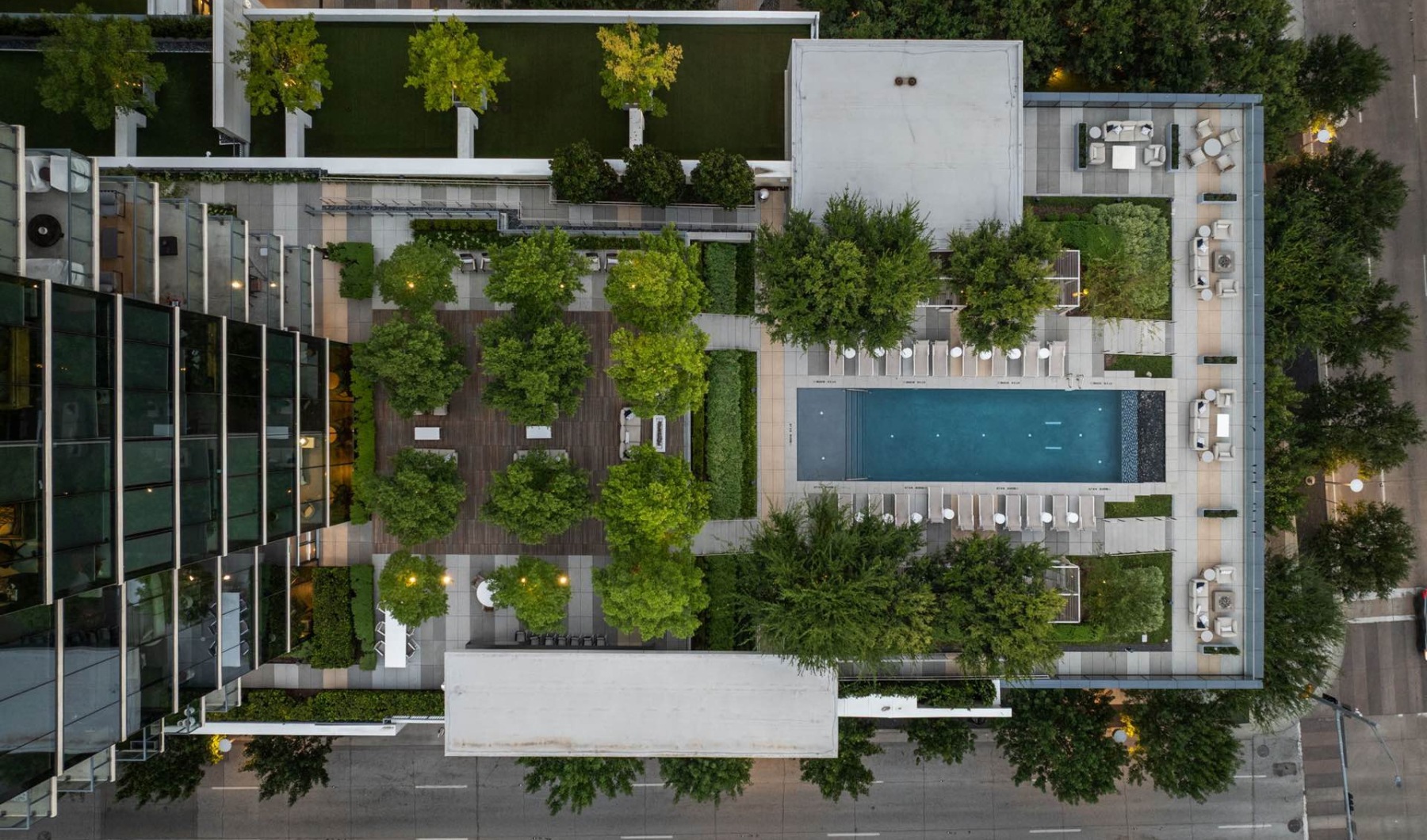an aerial view of a pool in a courtyard