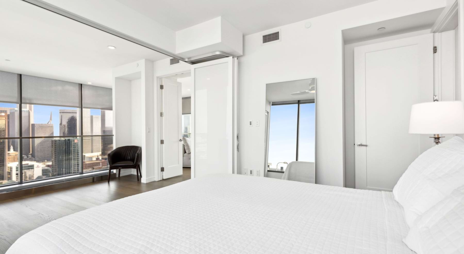 a bedroom with a bed and white walls