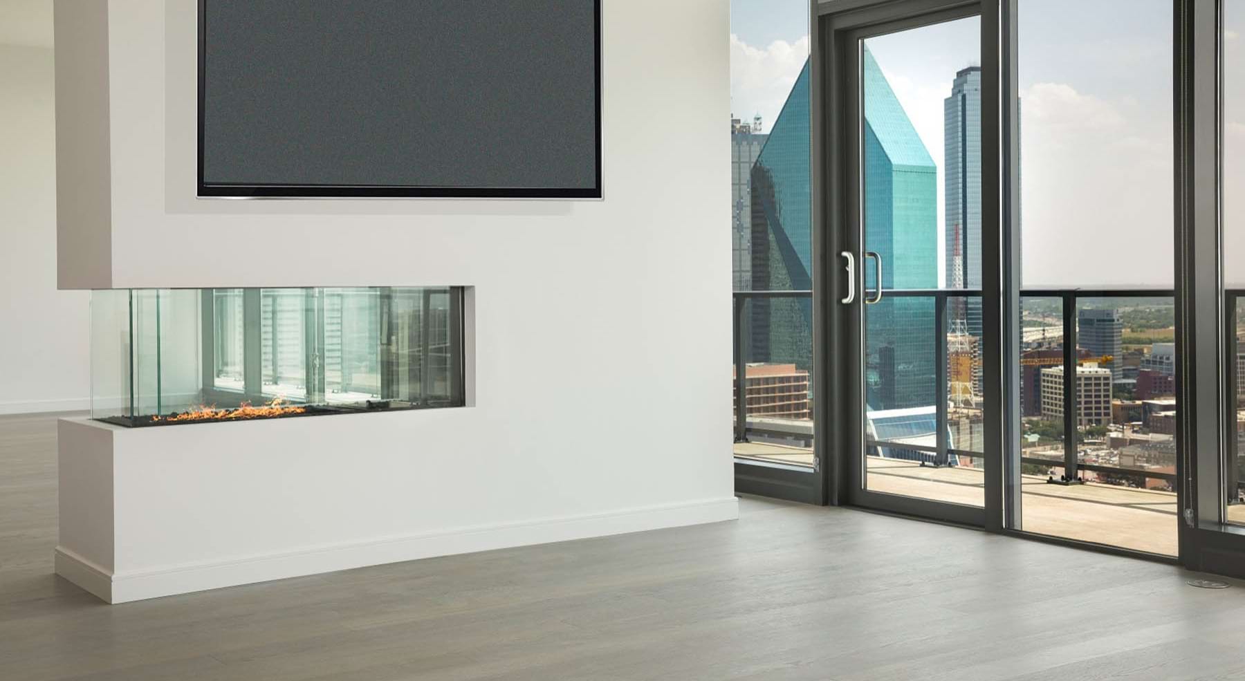 a living room with a fireplace and windows