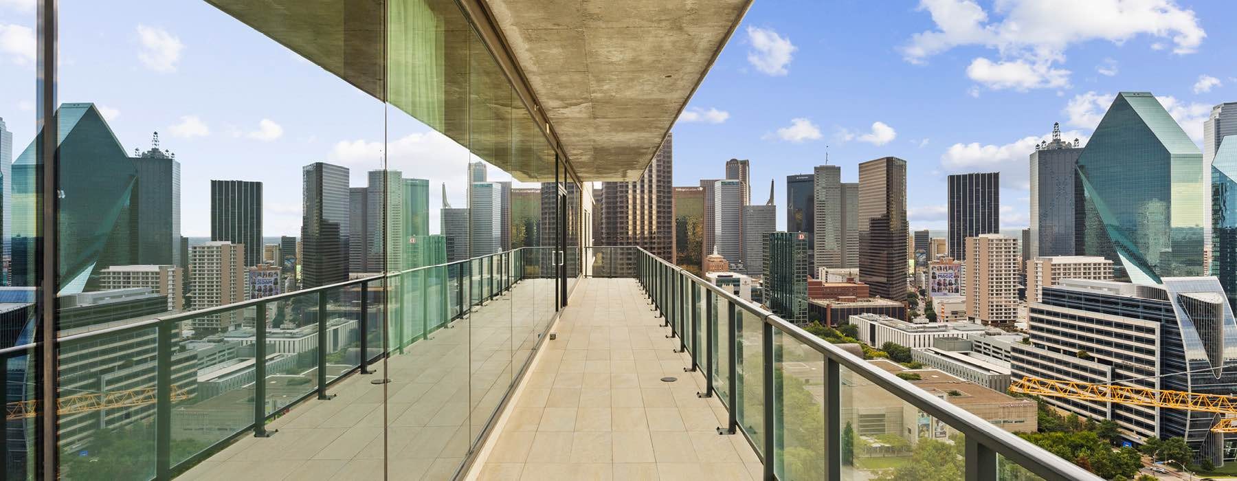 a balcony with a city in the background