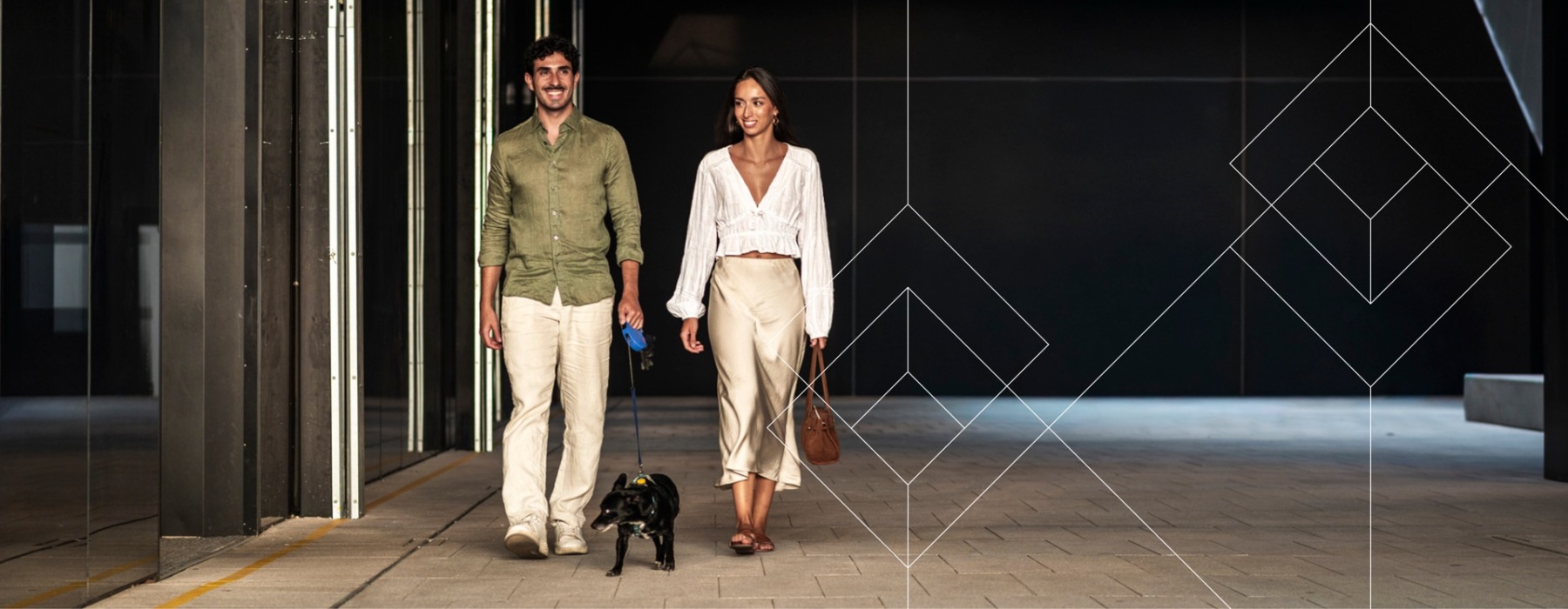 a couple walking a dog