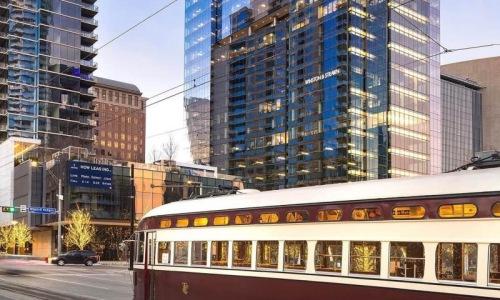 a train on a street in a city
